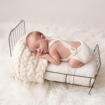 Newborn Baby Sleeping in Brass Bed Professional Portraits