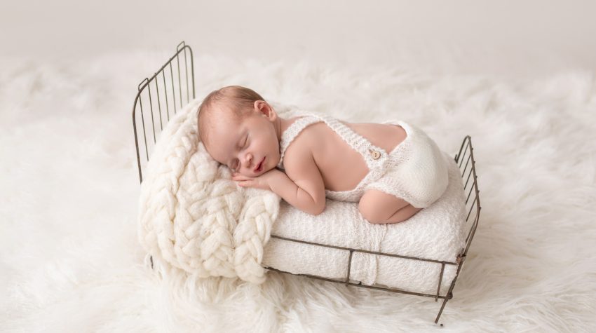 Newborn Baby Sleeping in Brass Bed Professional Portraits